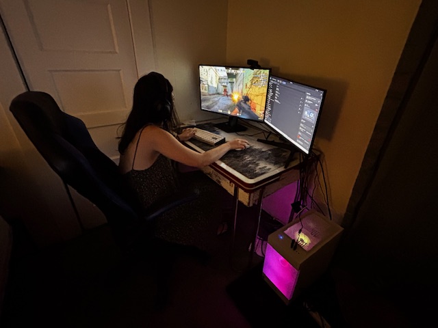 Hailey playing Marvel Rivals at her gaming setup